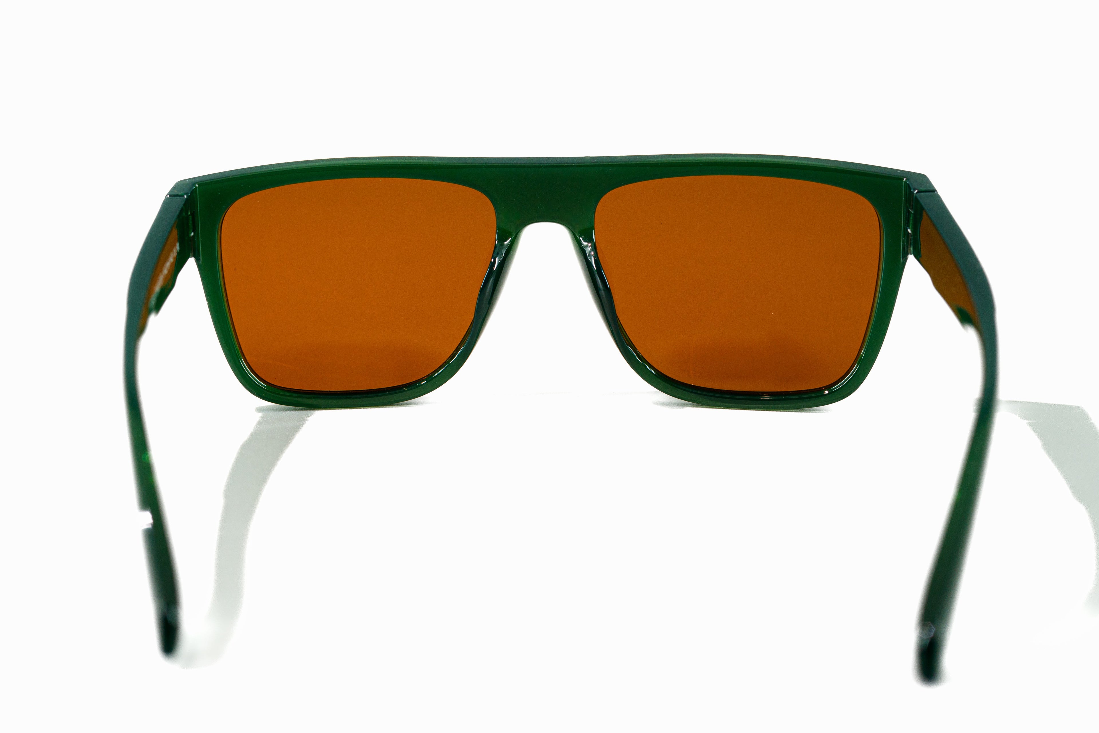 Sunglasses with green frame and brown lenses on a white background