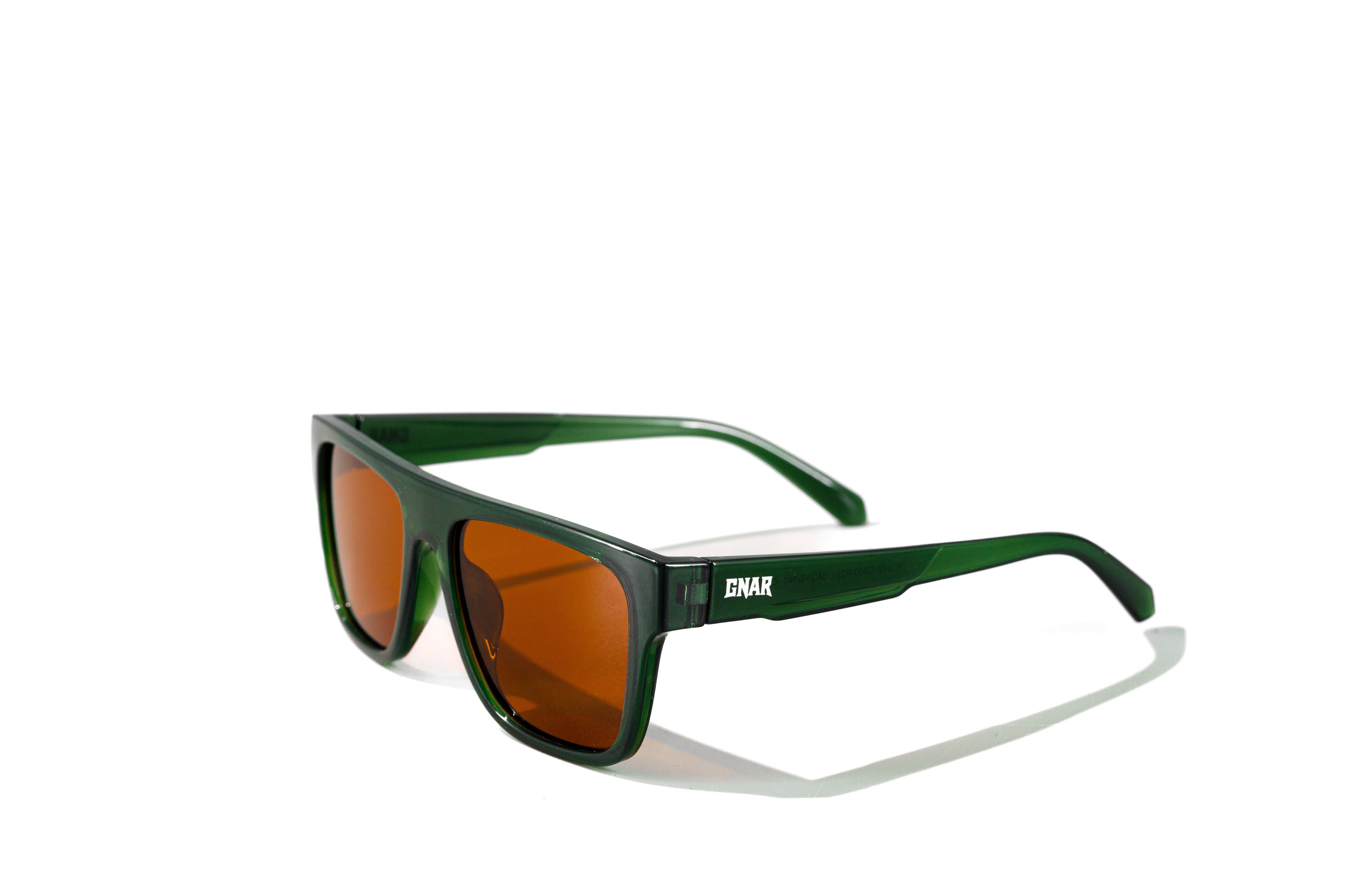 Green sunglasses with brown lenses on a white background