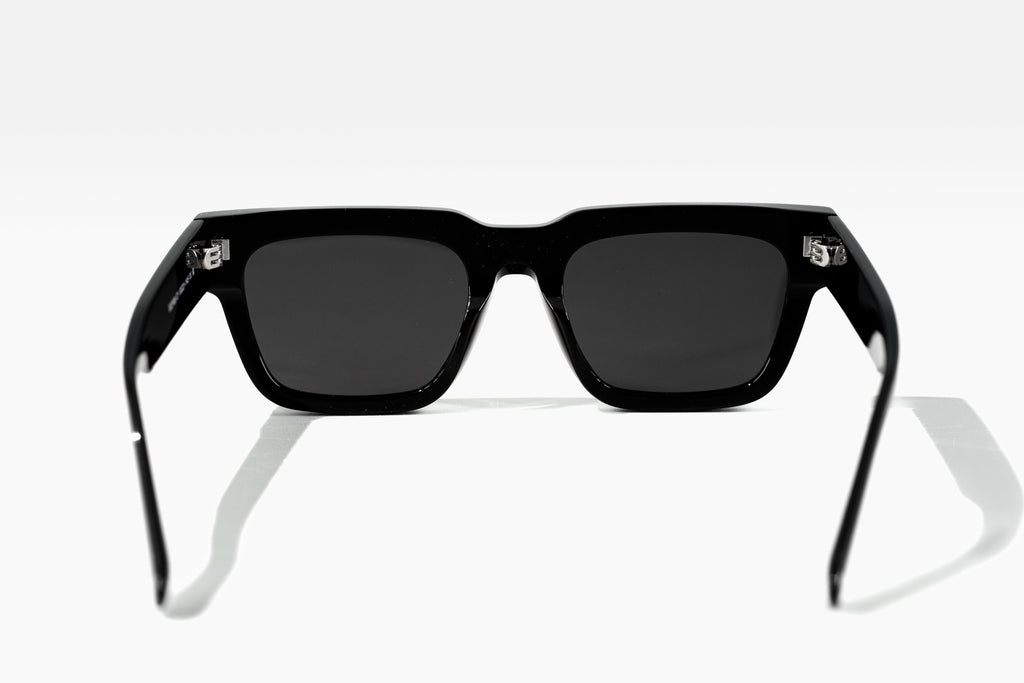 Black sunglasses with a reflective surface on a white background
