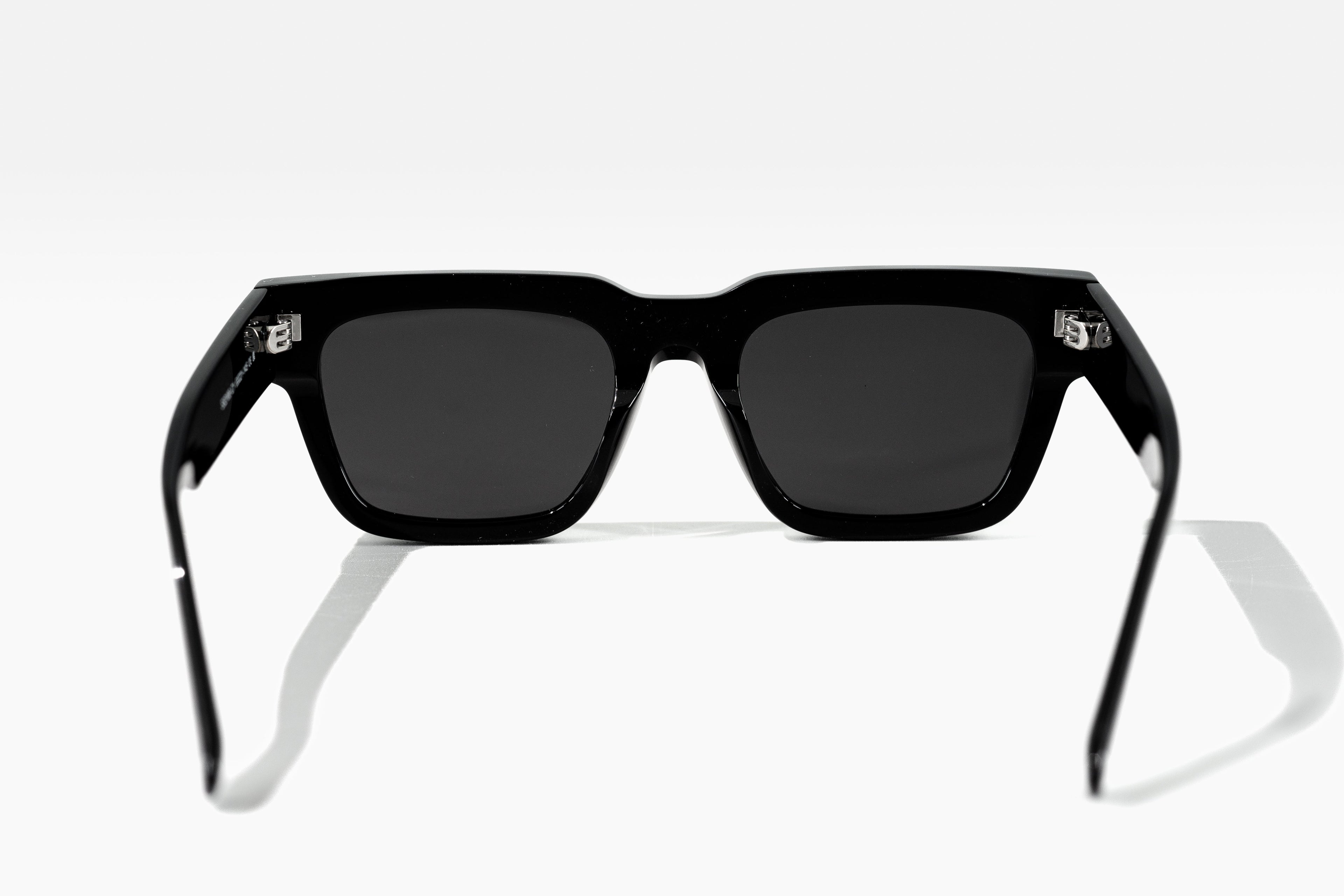 Black sunglasses with a reflective surface on a white background